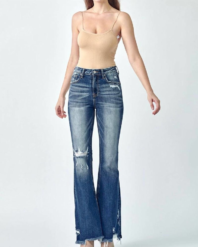 Front of a model wearing a size 1XL Women'S Flare Distressed High Rise Slit Jeans In Blue in Blue by RISEN. | dia_product_style_image_id:356792